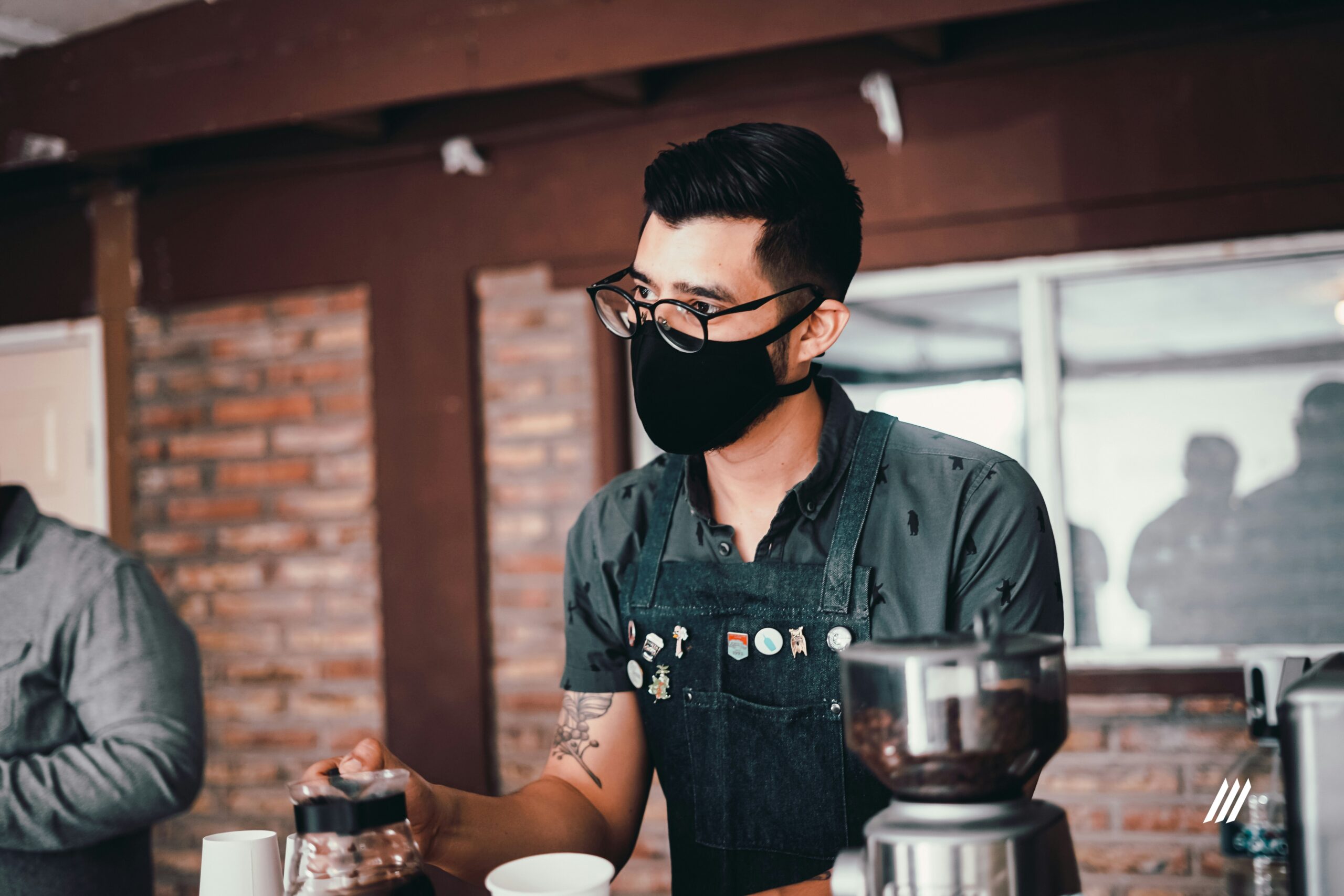 Man in Blue Shirt Holding Cup